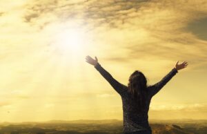 woman, sky, sunlight, arms, open arms, nature, sunbeams, sunrays, clouds, worship, freedom, happiness, relieved, prayer, praise, success, joy
